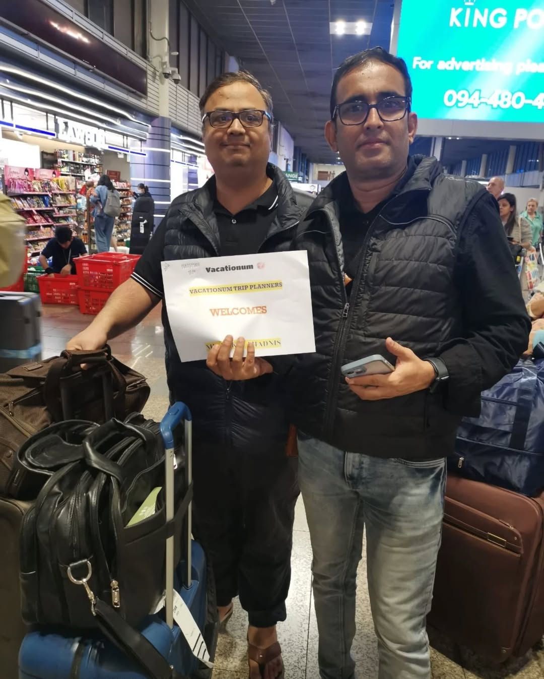 Two Tourist welcomed by Vacationum on ground team at Bangkok Airport.