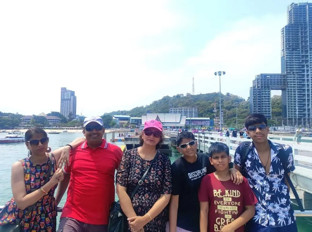 An Indian family posing on Pattaya, Thailand.