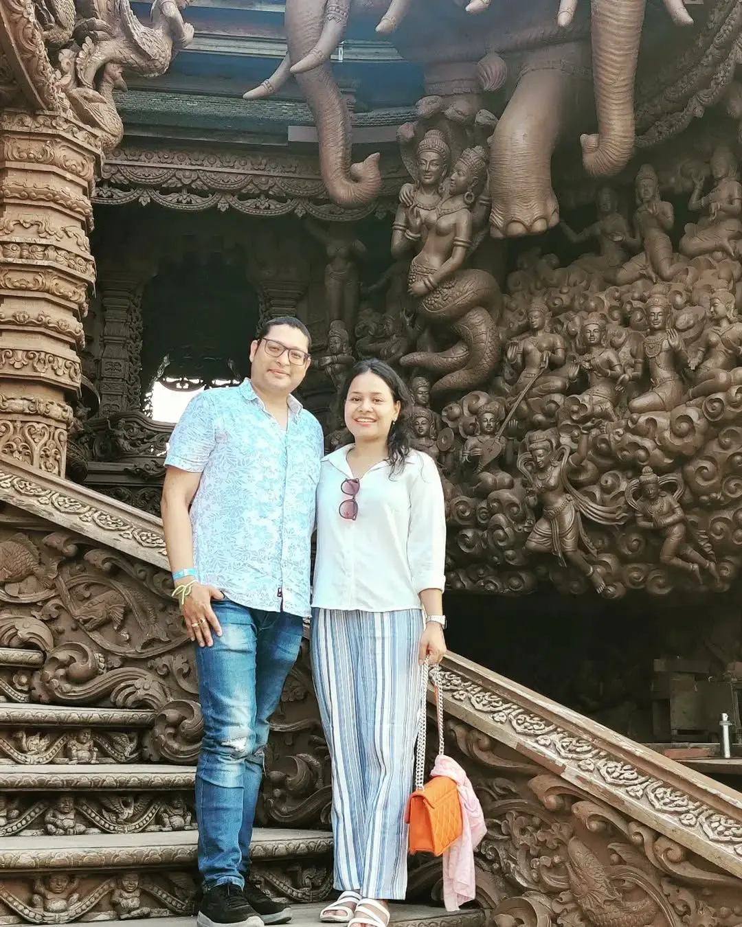 A smiling couple ready for their trip in Thailand.