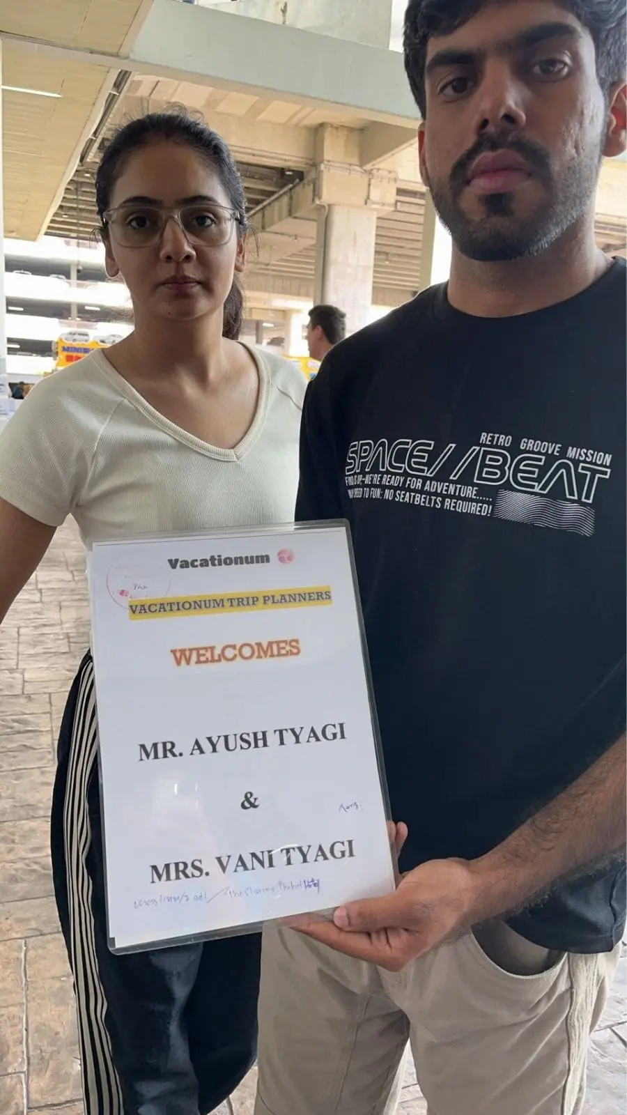 Indian couple welcomed with PLA card of Vacationum at Phuket Airport.