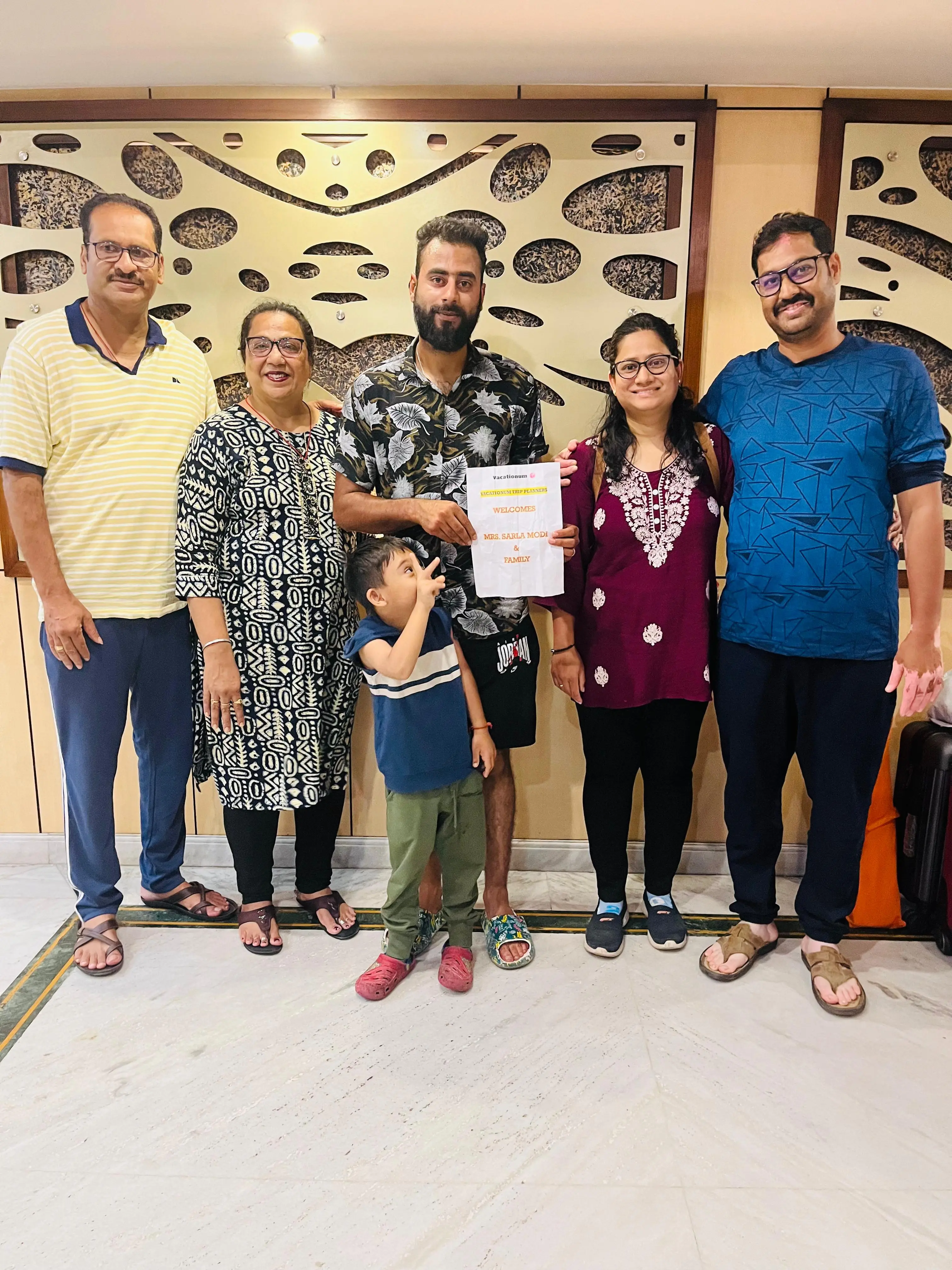 Family starting Kashmir tour with Vacationum Trip Planners welcome board.