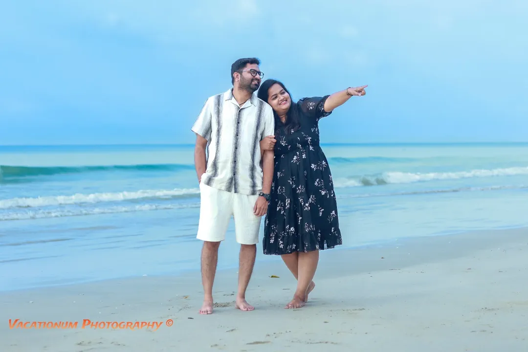 Honeymoon couple in relaxing on Radhanagar Beach, Havelock Island, Andaman.